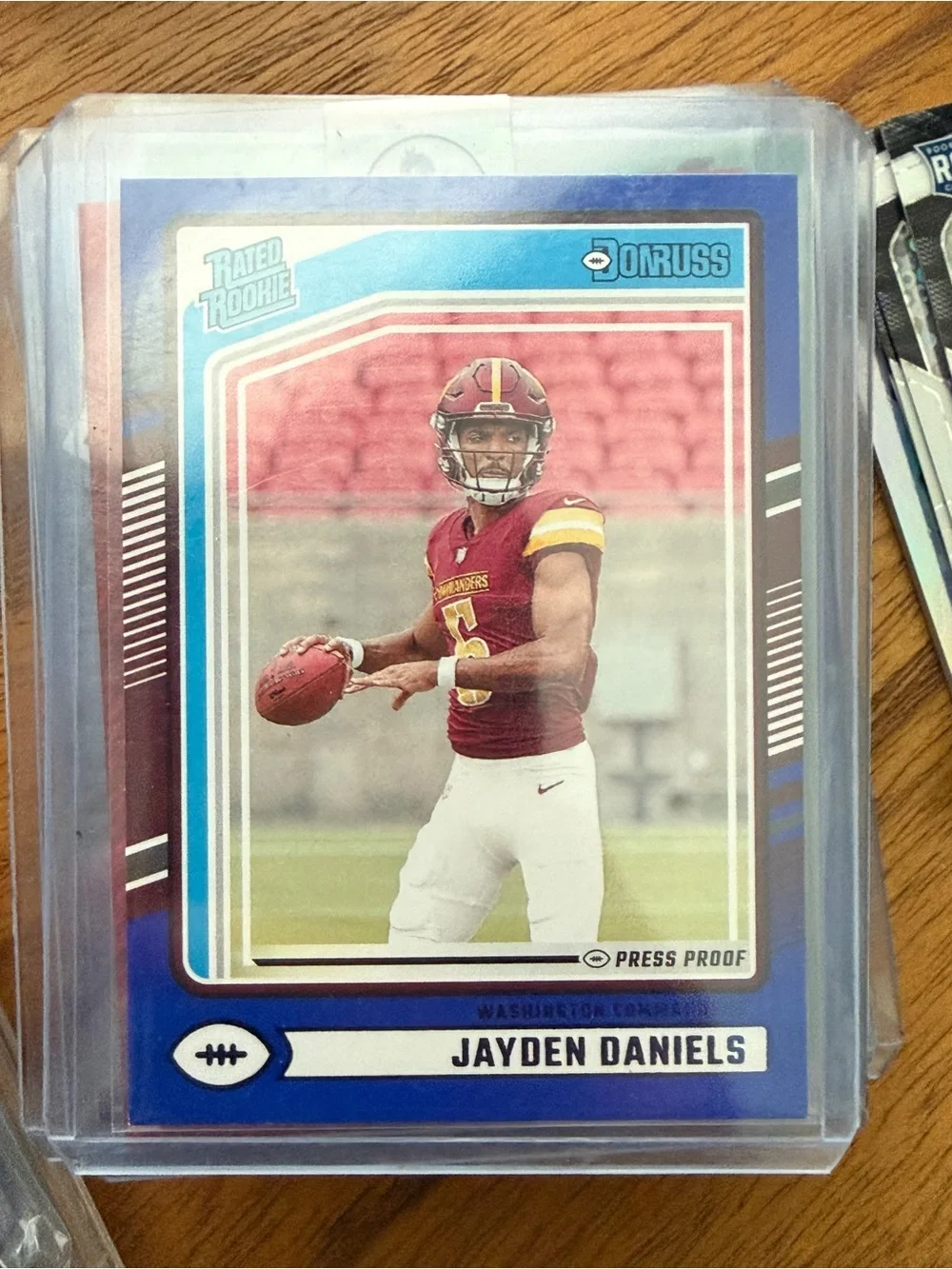 Jayden Daniels Football Rookie Card - Blue Border, Red Uniform